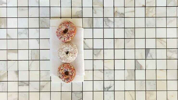 Donuts on Calacatta Gold Marble Square Mosaic tile