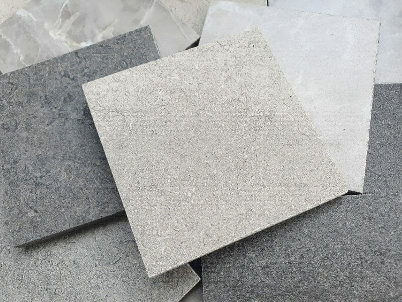 Pile of grey and beige tiles